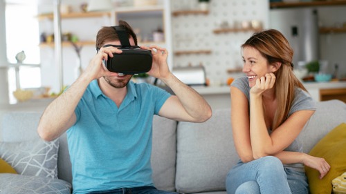 A couple using VR headsets